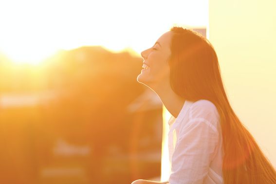 a woman enjoying the sun light